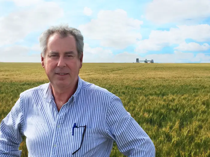 Photo of an agent standing in the field